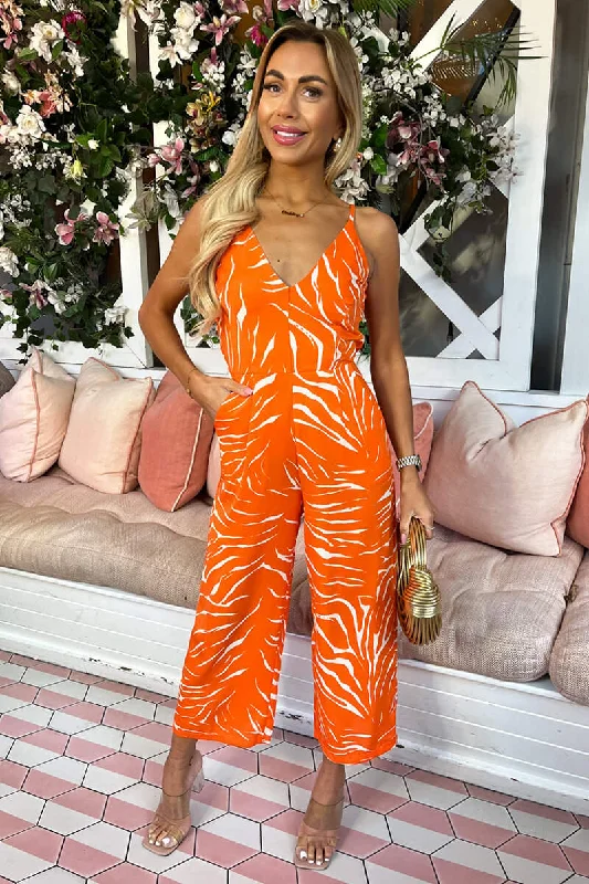 Metallic women jumpsuits for a dazzling New Year's Eve partyBlood Orange Animal Print V Neck Jumpsuit Metallic women jumpsuits for a dazzling New Year's Eve partyBlood Orange Animal Print V Neck Jumpsuit