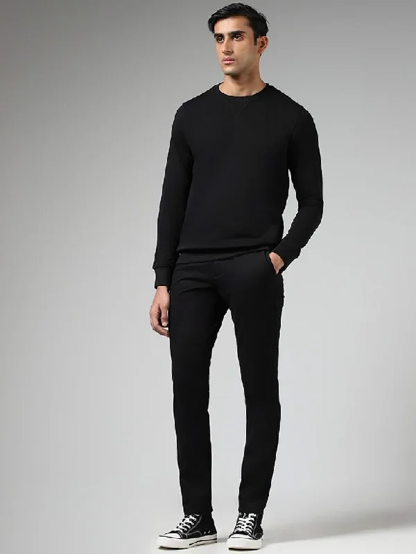 Women's polyester workout pants Button - fly women jeans with a traditional touch WES Casuals Solid Black Relaxed-Fit Mid-Rise Chinos Women's polyester workout pants Button - fly women jeans with a traditional touch WES Casuals Solid Black Relaxed-Fit Mid-Rise Chinos