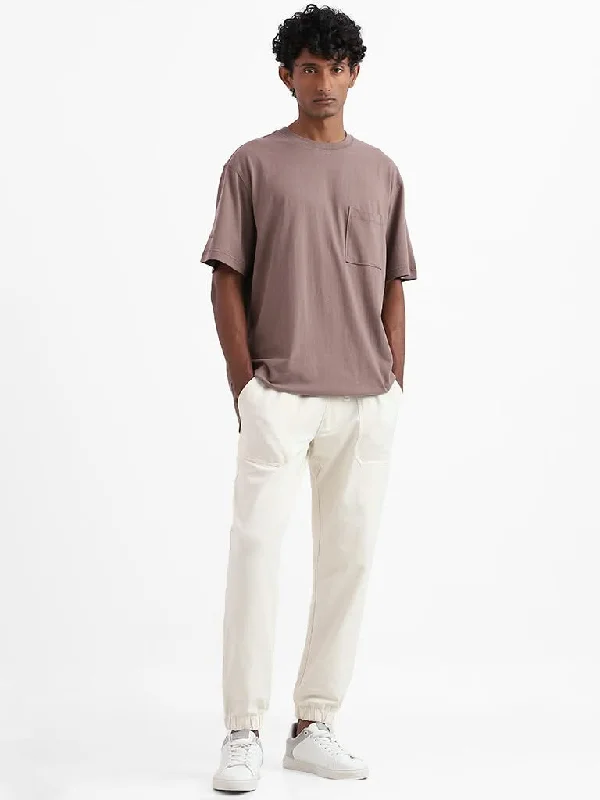Bermuda Women Shorts for a Classic and Sophisticated LookNuon Off-White Cotton Blend Relaxed-Fit Mid-Rise Joggers Bermuda Women Shorts for a Classic and Sophisticated LookNuon Off-White Cotton Blend Relaxed-Fit Mid-Rise Joggers