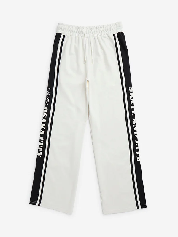 Solid Color Women Shorts in Bright Hues for a Bold StatementY&F Kids Off-White Text Design Mid-Rise Track Pants Solid Color Women Shorts in Bright Hues for a Bold StatementY&F Kids Off-White Text Design Mid-Rise Track Pants